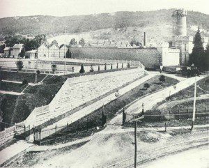 This photo, taken around 1887, shows the entrance to the Berks County Prison that stood at the head of Penn Street for 90 years. On the left we can see most of South Reservoir, which remained uncovered until 1910. Notice that there were separate, high iron fences around the prison grounds, the reservoir grounds, and the reservoirs themselves.